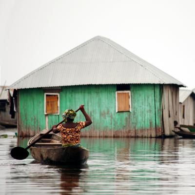 Woman travels through her flooded community in Mozambique Local woman paddles through the water in Mozambique after Cyclone Idai struck the country in March